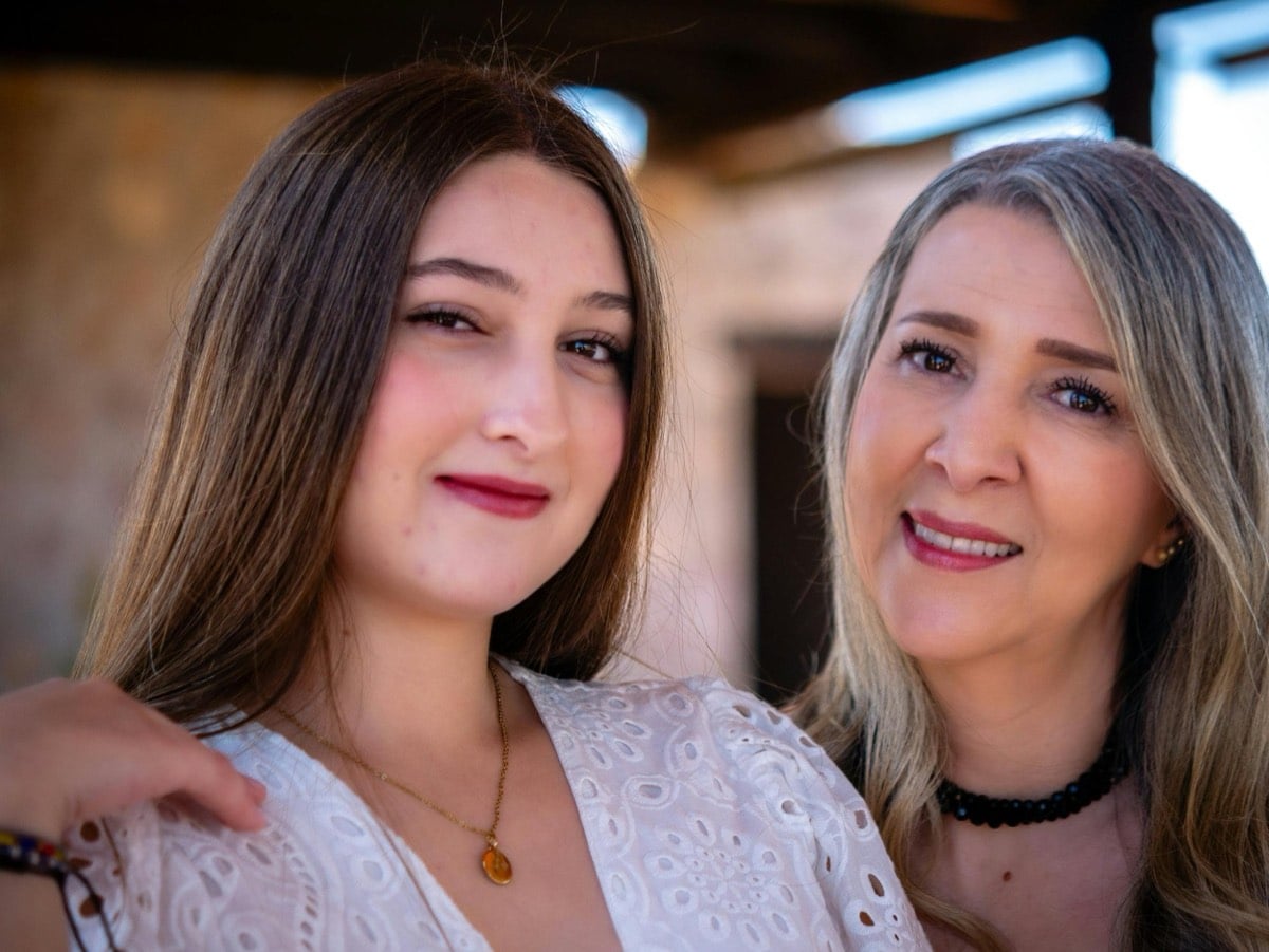 teen smiling with mom after counseling  in Frisco, Texas