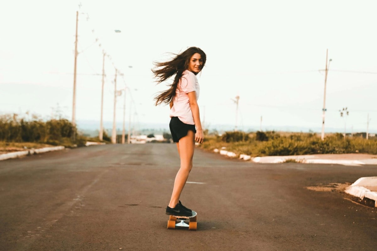 happy teen skateboarding after trauma therapy and counseling for teens in Frisco, Texas