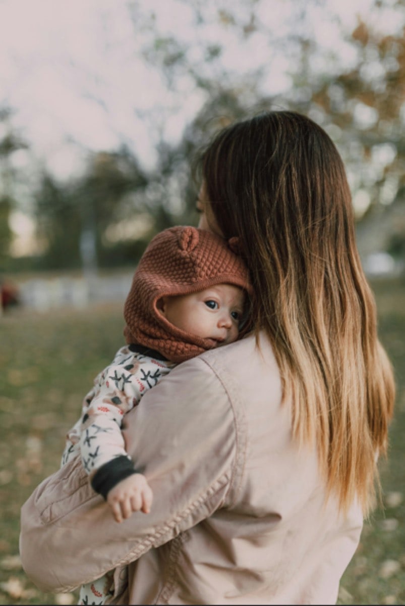 Mother with baby conquers postpartum anxiety after postpartum therapy at Counseling and Nature Therapy Center