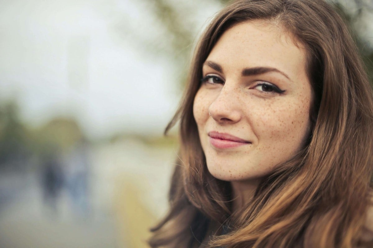 smiling woman after trauma therapy in Frisco. Texas