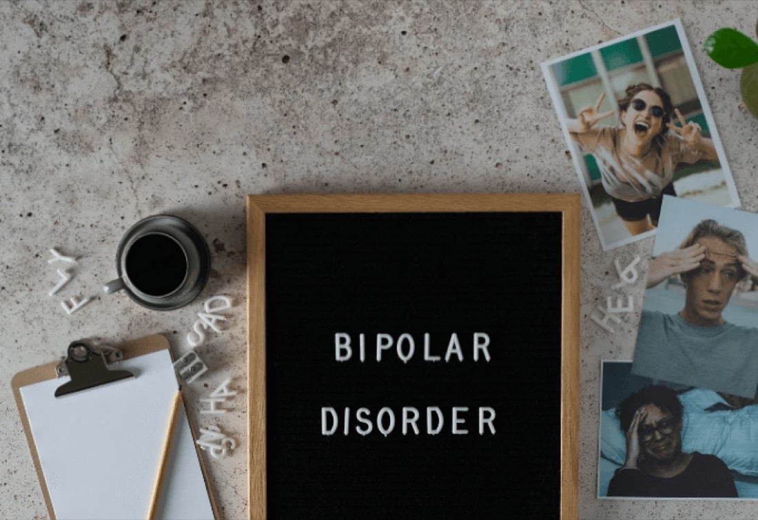 A hand-lettered sign about mental health held up outdoors